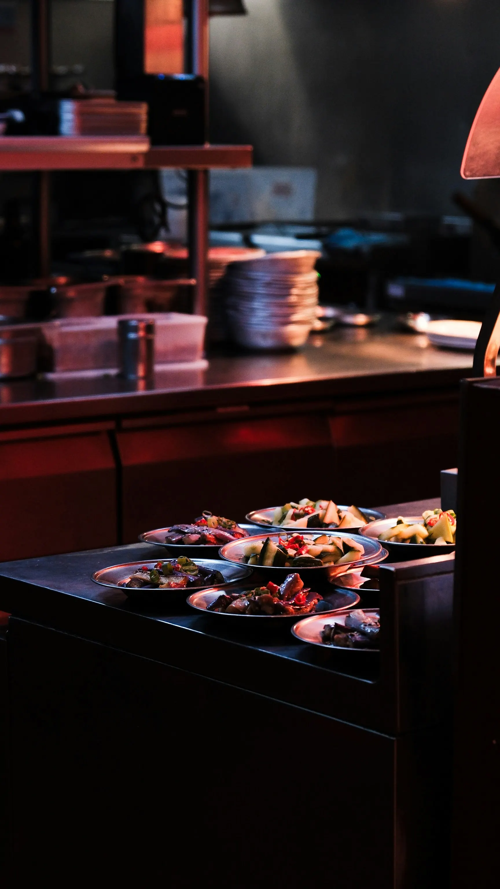 A table with plates of food on it in a kitchen