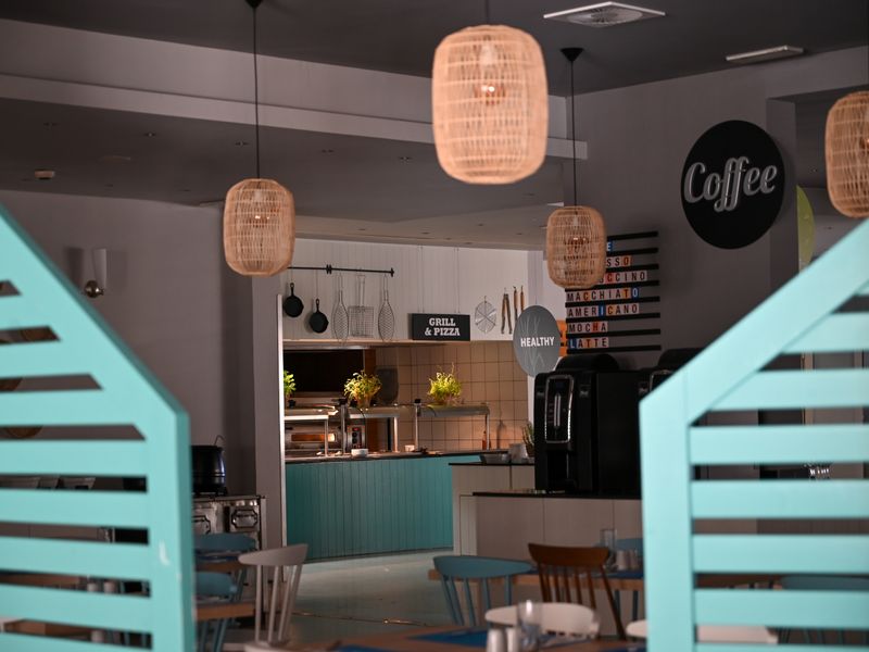 Café interior framed by wooden doors