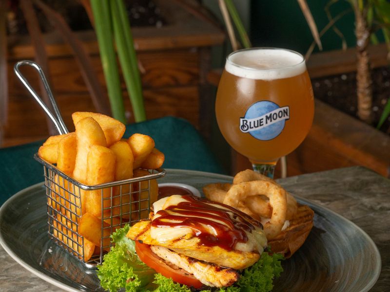 Pub meal with a burger, chips and beer